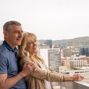 A Couple enjoys city views at the Little America hotel in Salt Lake City.