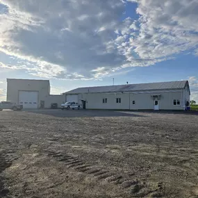 Front view of Chadwick-BaRoss building with work trucks parked outside