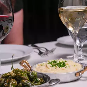 Blistered Shishito Peppers and Boursin Cheese Whipped Potatoes.