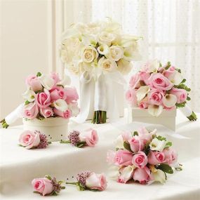 These hand-designed, Springtime bridal arrangements arrive fresh from our premier florists and include: • 1 White bridal bouquet, handcrafted from 18 pink roses, 12 white miniature Calla lilies and variegated pittosporum, tied with a crisp white ribbon; you may also choose an all-white bridal bouquet• 3 Pink bridesmaids bouquets, featuring 10 pink roses, 5 white miniature Calla lilies and variegated pittosporum, tied with a white satin ribbon.