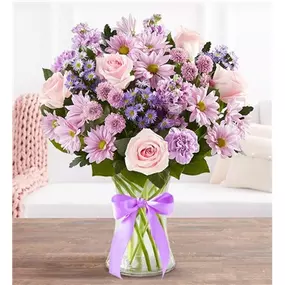 Just like a daydream. Our lavender bouquet is gathered with pops of pink and lush greenery inside a clear glass vase, capturing the rich beauty of the blooms, while delighting someone very special. Our florists hand-design each arrangement, so colors and varieties may vary due to local availability