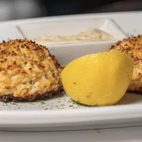 Maryland Style Crab Cakes feature jumbo lump crab, seasoned with Old Bay, and golden buttered bread crumbs.