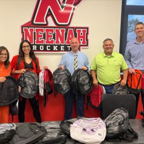 We are thrilled to announce that our recent Stuff the Bus event was a tremendous success! Thanks to the generous contributions from our community, we were able to donate 100 backpacks to the Neenah School District.