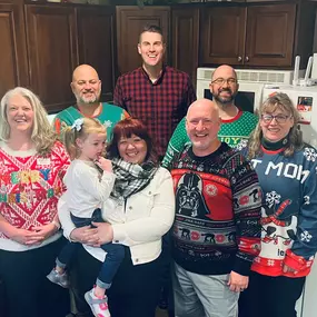 Celebrating the holidays with ugly Christmas sweaters in Neenah with Dave Mader State Farm insurance agent