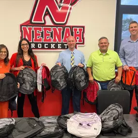 We are thrilled to announce that our recent Stuff the Bus event was a tremendous success! Thanks to the generous contributions from our community, we were able to donate 100 backpacks to the Neenah School District.