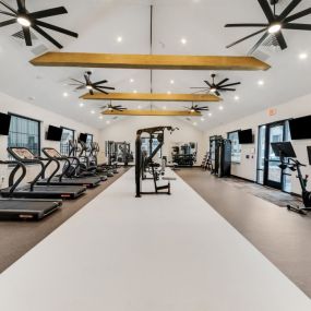 The gym with treadmills and other equipment