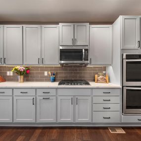 Soothing gray kitchen cabinets after cabinet painting