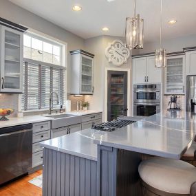 Blue and gray kitchen cabinets after cabinet painting