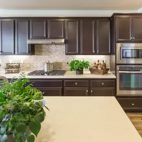 Large kitchen after cabinet painting in Cohasset