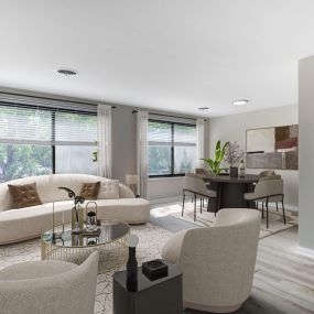 Living room and dining room with white walls and wood floors