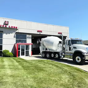 Housby Truck Lube Featuring A White Mack Truck