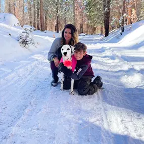 Steve Ferraro Jr. State Farm Insurance agents team member enjoying the snow with son and dog