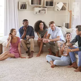 Friends gathering in a home after professional carpet cleaning in Canon City