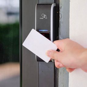 Employee using a keycard to enter a building
