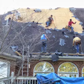 Workers Cleaning up the Roof