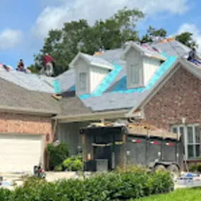 Workers are fixing rooftop of a house