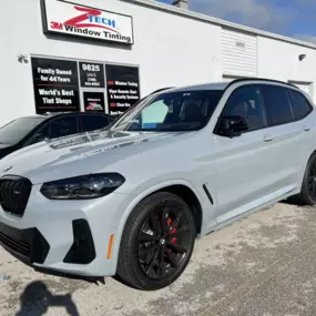 z-tech window tinting and auto- detailing on large grey car