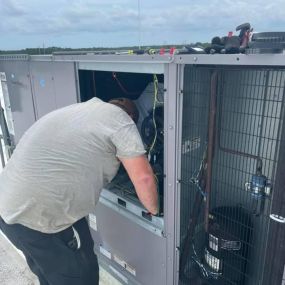 Kuebler Mechanical Technician working on unit