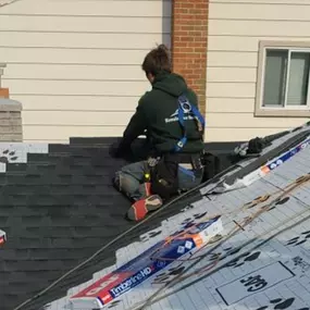 contractor repairing roof