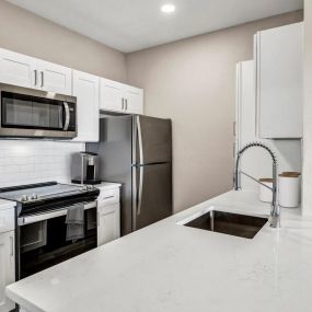 Kitchen with Stainless Steel Appliances and Quartz Countertops