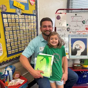 Last week, Rick had the honor of being the “Mystery Reader” in his youngest daughter Addie’s kindergarten class at Ashford Park Elementary. Addie was so excited, she pulled up a stool beside him and helped turn the pages as he read. Moments like these are a reminder that the best titles in life aren’t on business cards, but in the little hands that reach for ours.