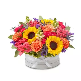 EXCLUSIVE An exquisite gift with beautifully bespoke style. Our vibrant gathering of blooms is arranged in our signature European hatbox: an elegant, new dove gray container finished with a matching ribbon. Its versatile design is perfect for displaying a variety of colors, adding to the custom feeling of this special keepsake.