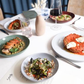 Sassetta table with 5 plates of food