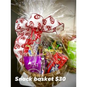 Aaf Snack Basket - An assortment of snacks and drinks wrapped in a basket. VARITIES AND CONTAINERS WILL VARY DEPENDING ON SUPPLY.