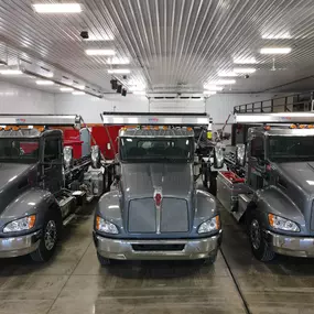 redbox+ trucks in a garage