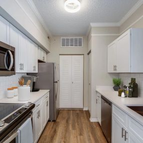 Deluxe kitchen featuring white cabinetry