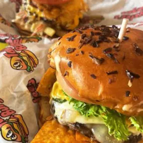 close up images of two customers burgers they ordered at the Taystee's Burgers in Ann Arbor