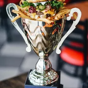 Burger and Fries in an awarded cup to Taystee's Burgers - Home of the Best Burgers in Town