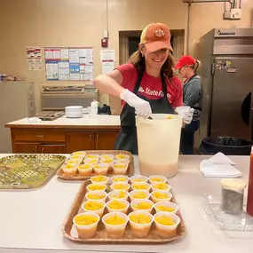 John Acker State Farm team volunteering at Our Lady of Mercy Community Outreach's Soup Kitchen!