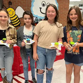 Celebrating the joys of springtime with our future leaders! These young minds are enjoying a delightful treat during our celebration at the local school. It’s moments like these that remind us of the importance of community and togetherness.