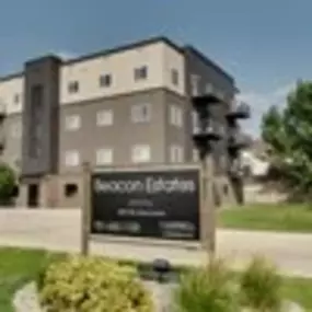 a building with a sign that says beacon estates, Fargo, ND