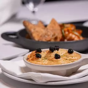 Maine Lobster Escargot with Chick Lobster, truffle mornay sauce, and topped with caviar