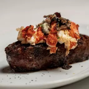 Black Truffle Sautéed Maine Lobster atop Prime Steak