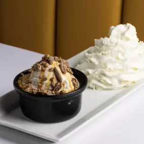 Warm Vanilla Caramel Cake—served with vanilla gelato, sweet whipped cream, and house-made toasted brown sugar cinnamon pecans.
