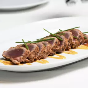 Our Pepper-Crusted Big Eye Tuna brings bold flavor and buttery texture in every bite