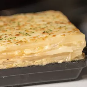 Chef Siegfried's au Gratin Potatoes—layers of caramelized onion, Gouda, and mozzarella stacked high.