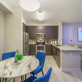 Dining Area and Kitchen at Icon One Daytona in Daytona Beach, FL