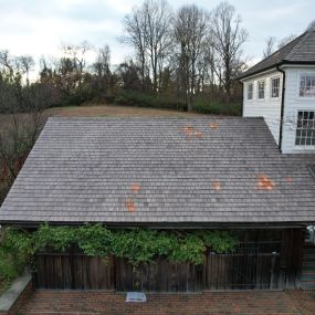 a roof with shingles repaired by Class Roofing