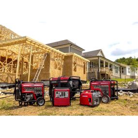 Different types of Honda generators displayed on a construction site