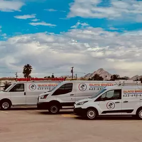 hvac trucks parked in front of arizona skyline