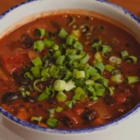 Warm up with a hearty bowl of house-made chili at The Corner—loaded with rich spices, black beans, tomatoes, and topped with a fresh hit of scallions. It’s comfort food with attitude, perfect after a round of games or during happy hour.