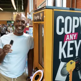 Customer with Newly Duplicated Car Key at KeyMe Kiosk