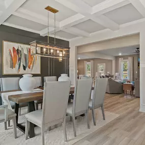 Dining room with coffered ceiling in DRB Homes Flakes Mill Community