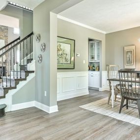 Dining room and staircase at DRB Homes Worthington Village at Charles Pointe