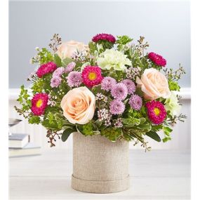 Every glorious day begins with fresh, beautiful flowers…and our new bouquet has a lot! Soft peaches and lavenders mix with hot pink and lime green, all gathered in our neutral-toned hatbox to really let each bloom shine.