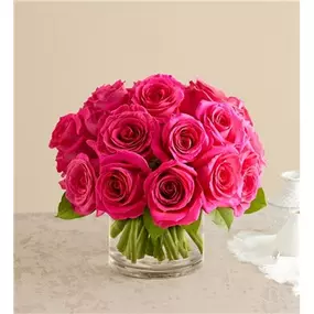 Eye-catching hot pink roses with a fun, modern vibe. Our vibrant blooms are tightly gathered into a chic dome shape with lush greenery by local florists, then hand-delivered to someone special with style and sentiment. All-around arrangement with hot pink roses; accented with assorted greenery Our florists hand-design each arrangement, so colors, varieties and container may vary due to local availability